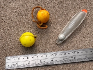 Plastic or metal floats used by anglers